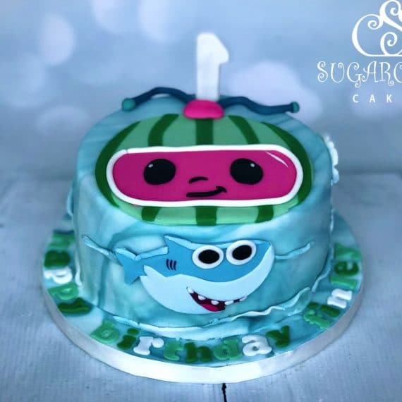 A Cocomelon and Baby Shark Themed 1st Birthday Cake