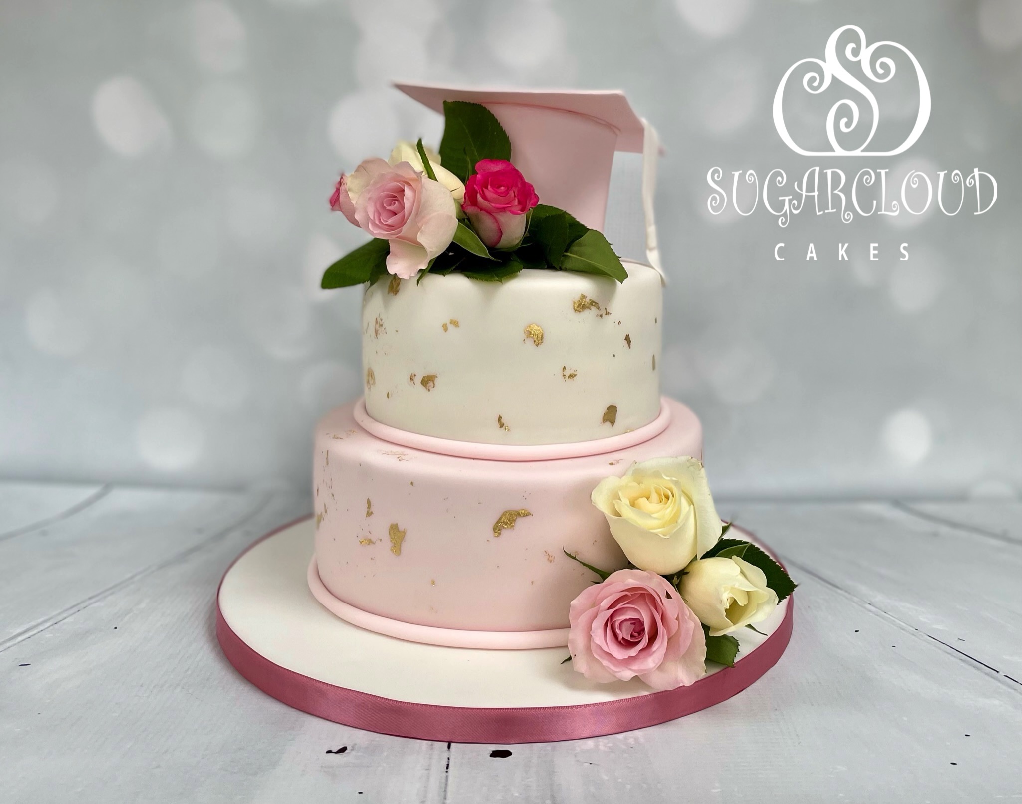 A Pink Floral Themed Graduation Cake