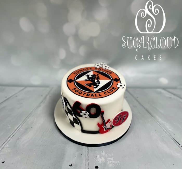 A 60th Birthday Cake with a mixed theme of F1, Foo Fighters and Dundee United, Nantwich