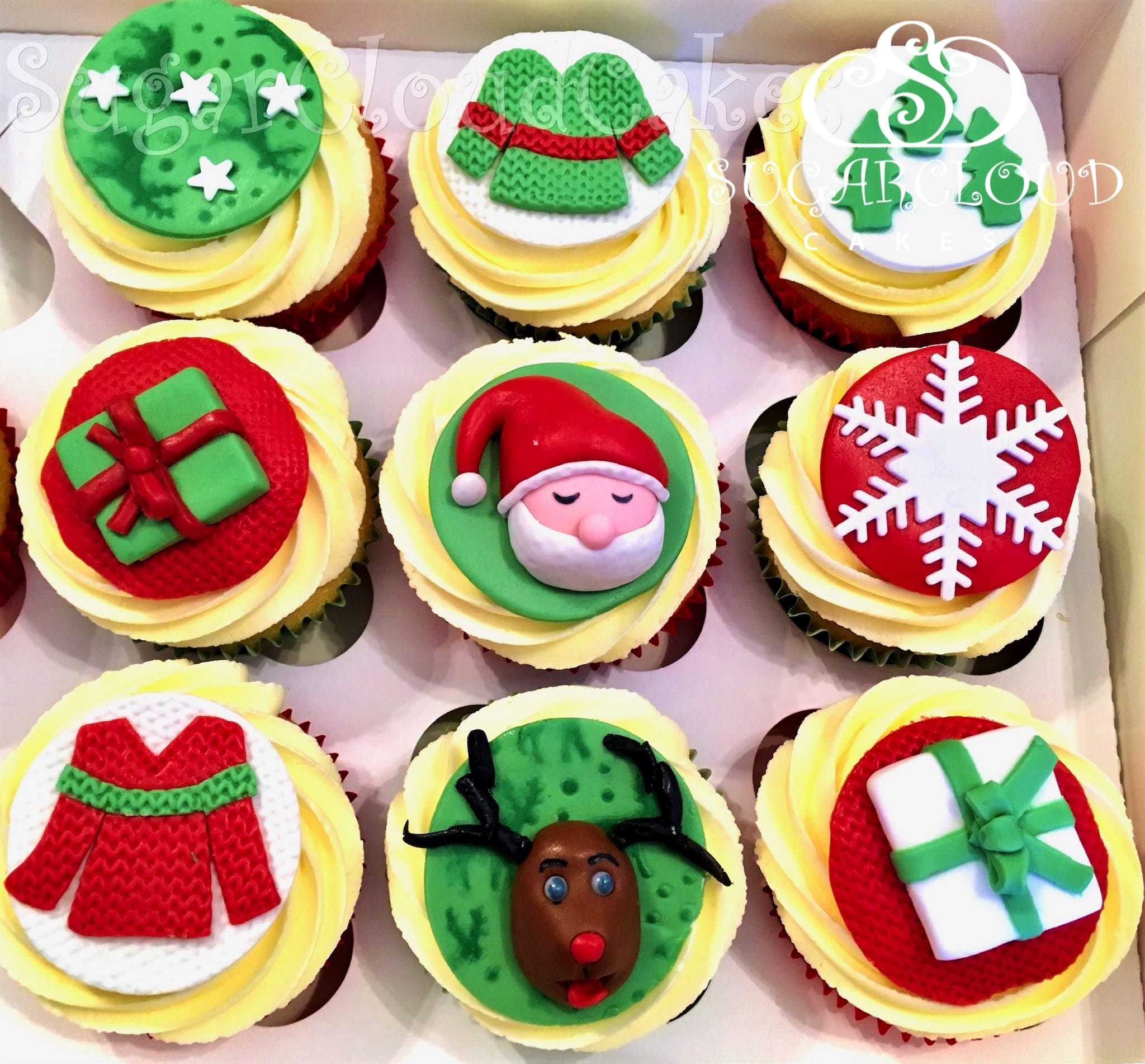 Vanilla cupcakes topped with Christmas Themed Toppers, Crewe