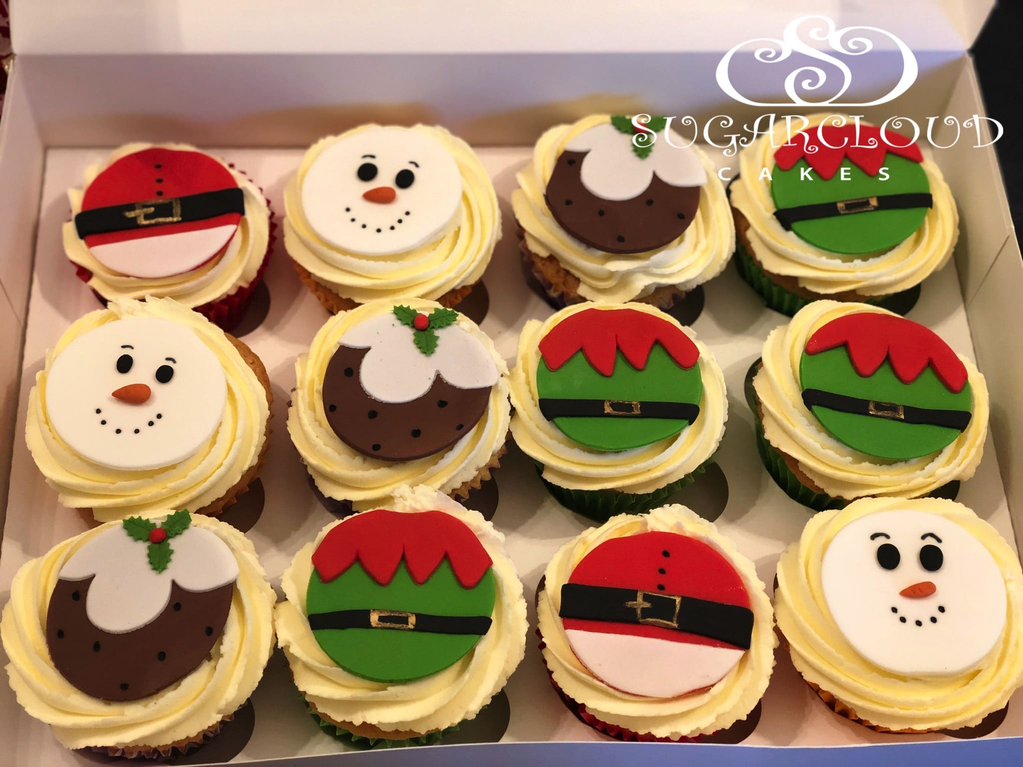 Vanilla cupcakes topped with Christmas Themed Toppers, Crewe